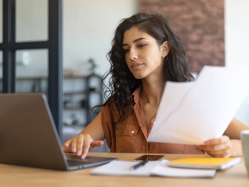 Businesswoman checking insights on her computer