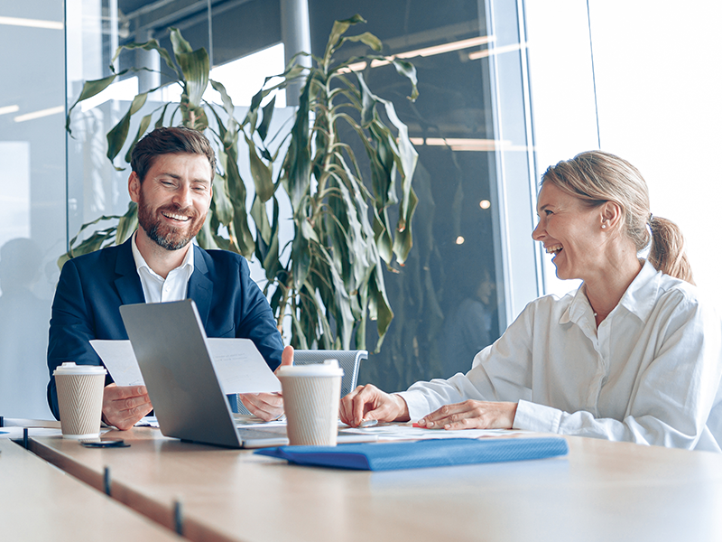 Two business people meeting on a computer