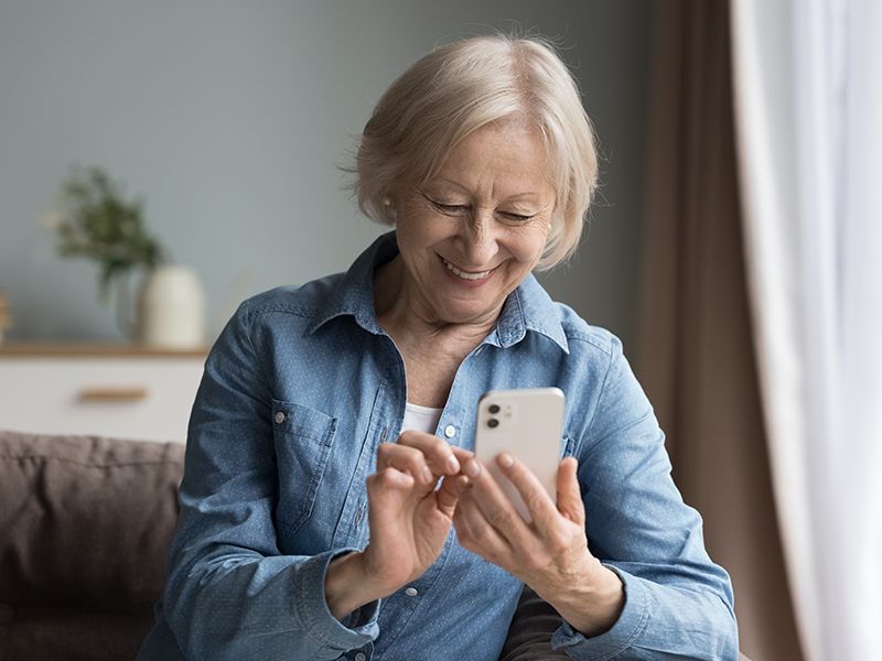 Senior lady browsing online on her mobile