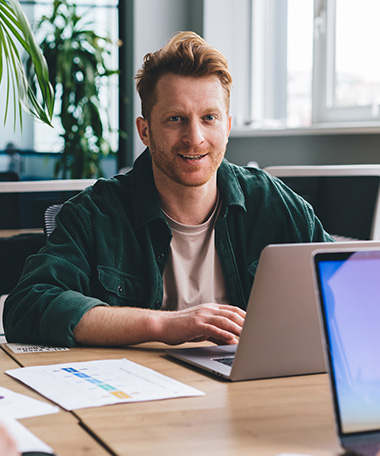 Employee at a shared space desk