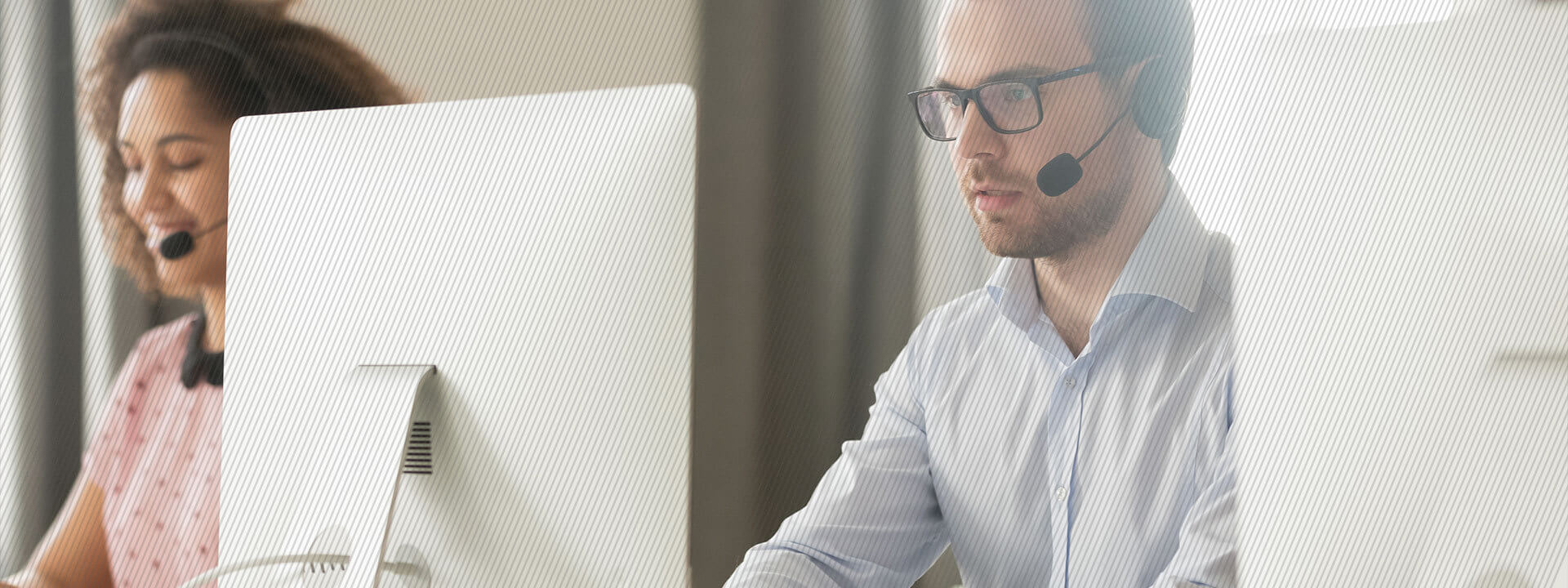 contact center employee on computer screens 