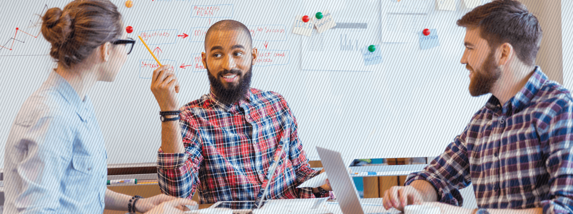 Section-5-How-toThree happy coworkers sitting at a conference table wring-the-most-out-of-your-customer-journey-maps