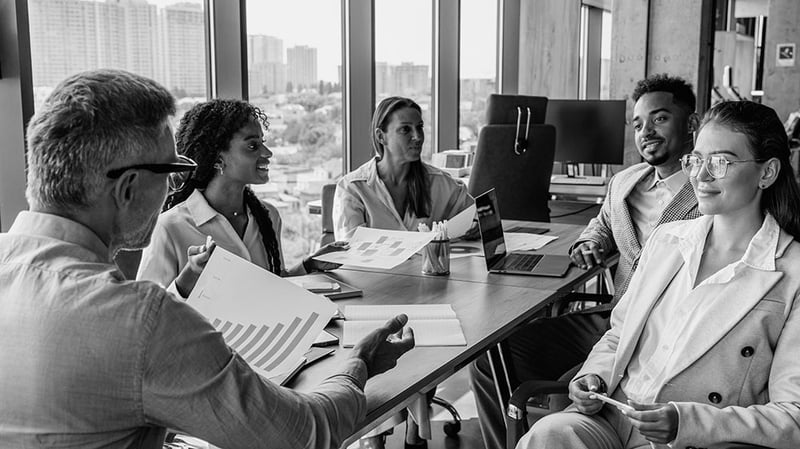 Business leaders collaborate on a strategy meeting.