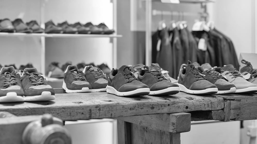 Display of shoes in modern mens clothing store