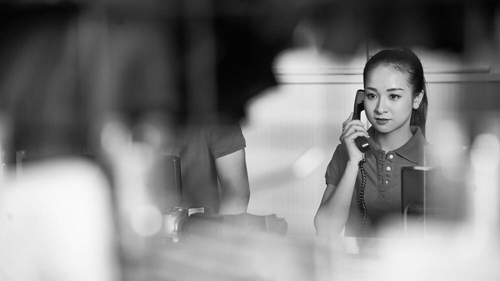 A female professional answering the phone.