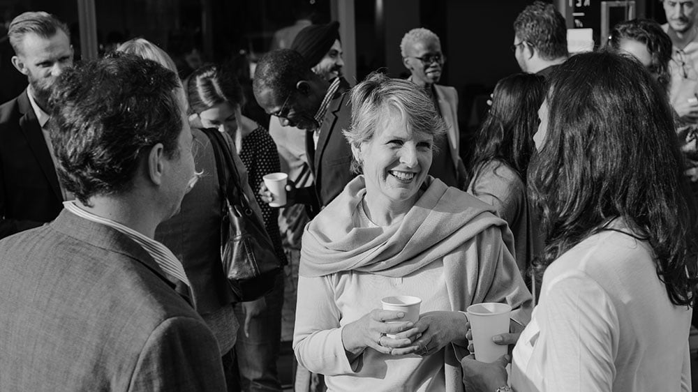 Group of diverse business people socializing.