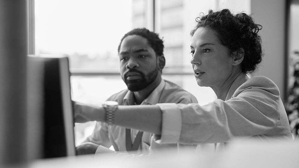 Business colleagues cooperating while working.