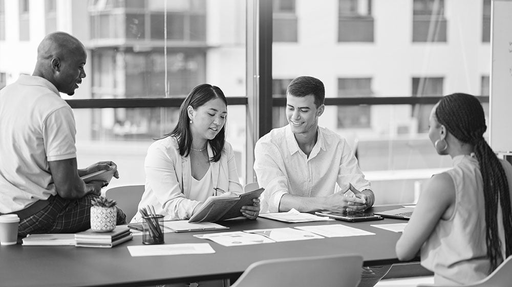 Team discussing business plans at a modern office.