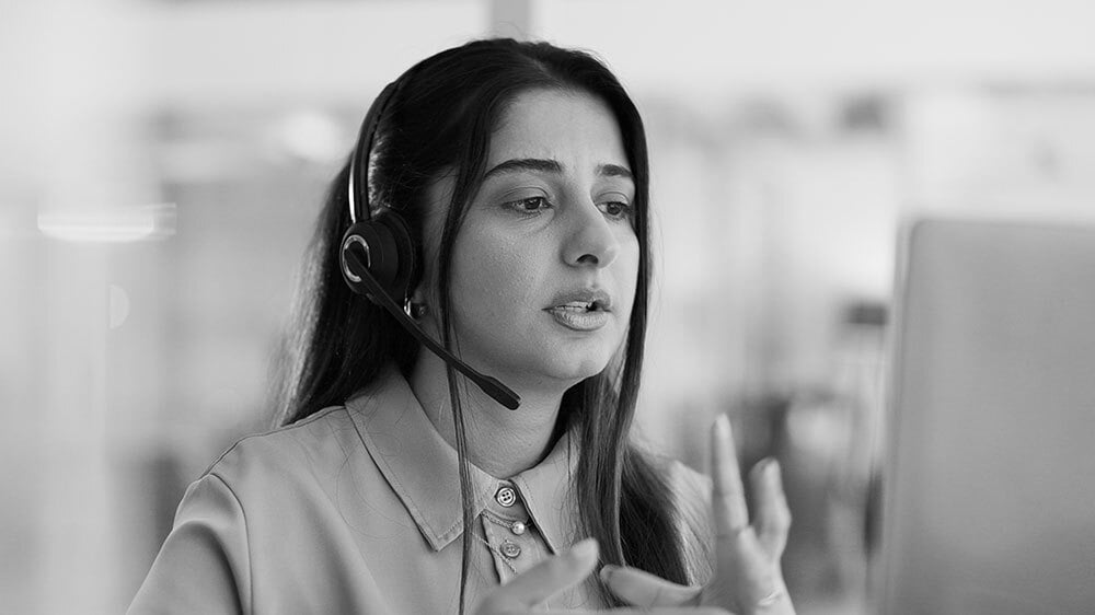 A customer service representative attentively handling a client call.