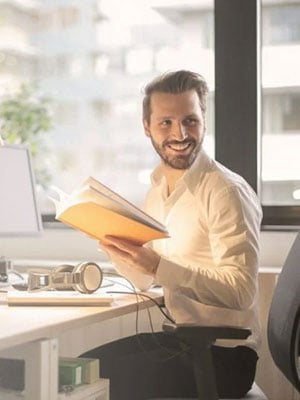 Male Employee reading a book