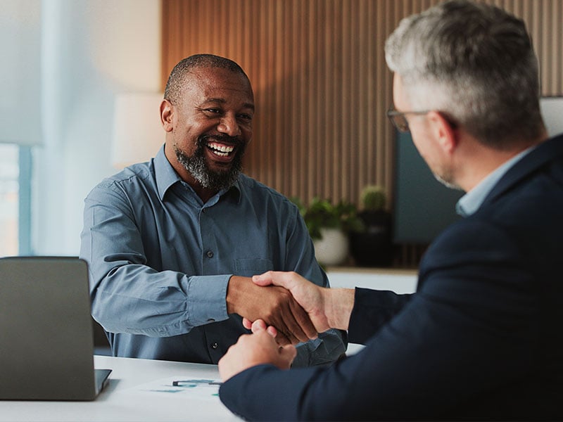 Two men agreeing in a business meeting
