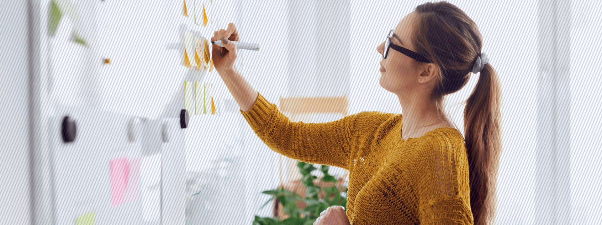 Woman writing on a whiteboard