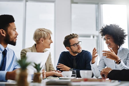 Shot of a group of businesspeople sitting together in a meeting