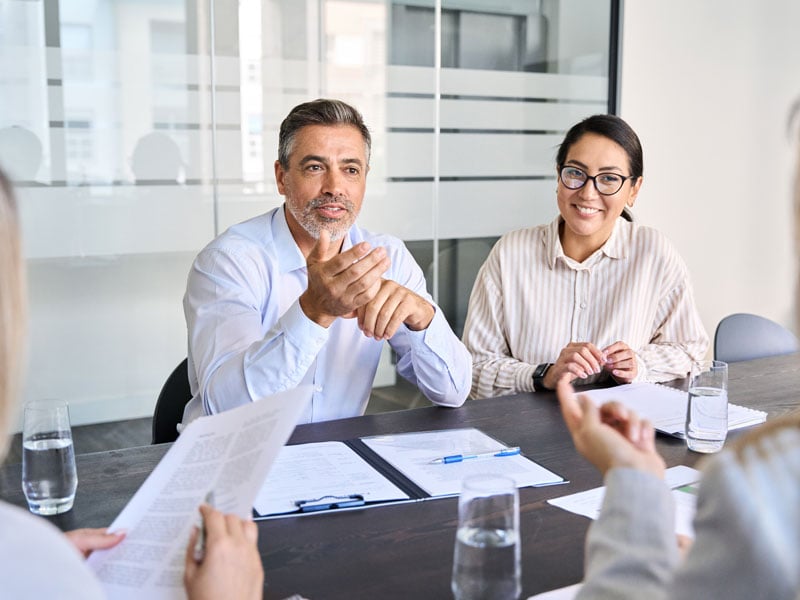 A businessperson leading a meeting