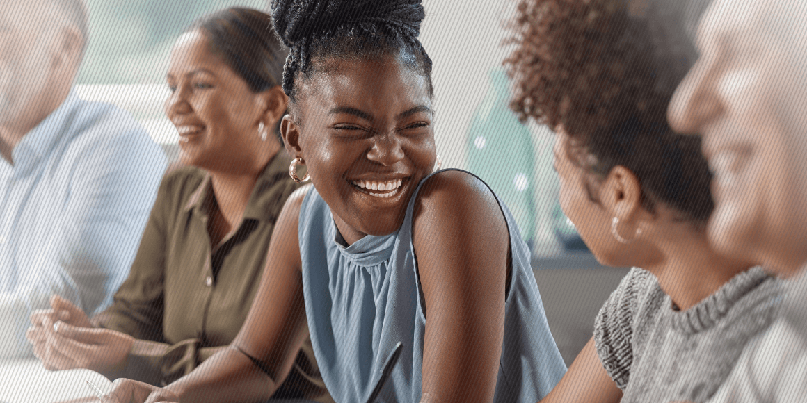 Featured image: Group of business people laughing during a meeting - Read full post: How Employee Surveys Boost EX