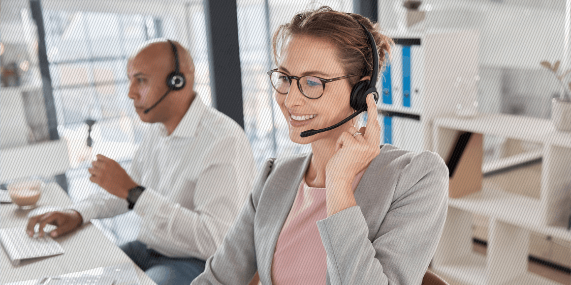 Featured image: A happy contact center representative speaking with a customer - Read full post: Improve Contact Center Experience With Journey Analytics