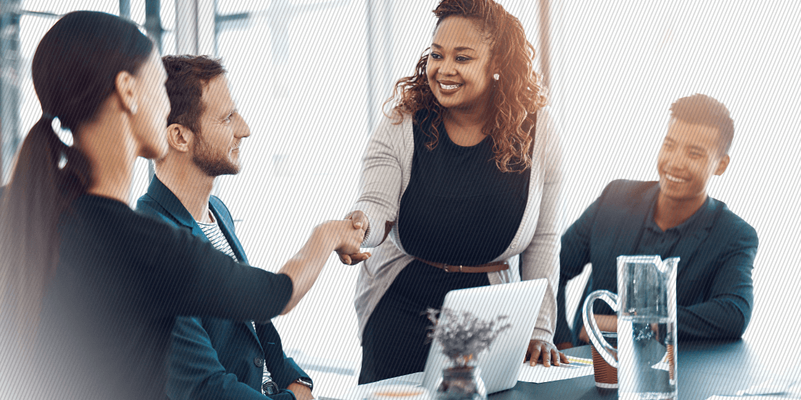 Featured image: Business woman onboarding a new coworker in a conference room - Read full post: Why Empowering Employees Should Be Part of Your Employee Experience Strategy
