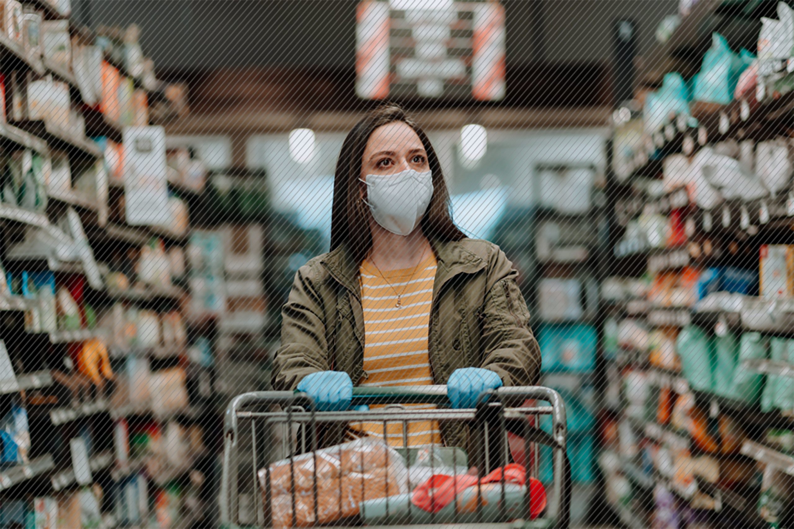Featured image: Woman wearing a face mask and gloves pushing her cart down a grocery isle - Read full post: Omni-channel customer experience and COVID-19; Catching Our Breath