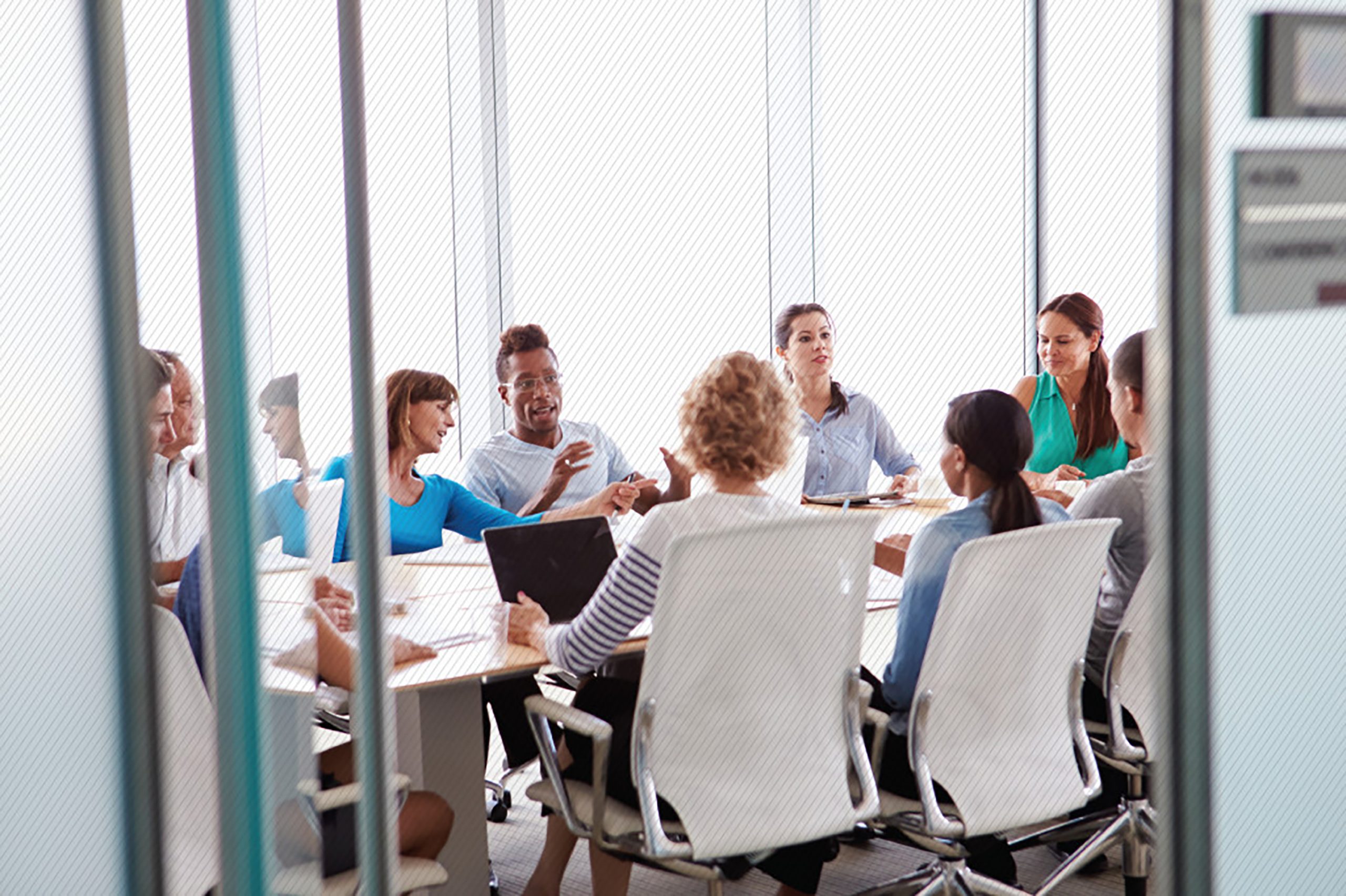 Featured image: A customer experience team meeting in a board room  - Read full post: Common Critical Aspects Of A Customer Experience Organization