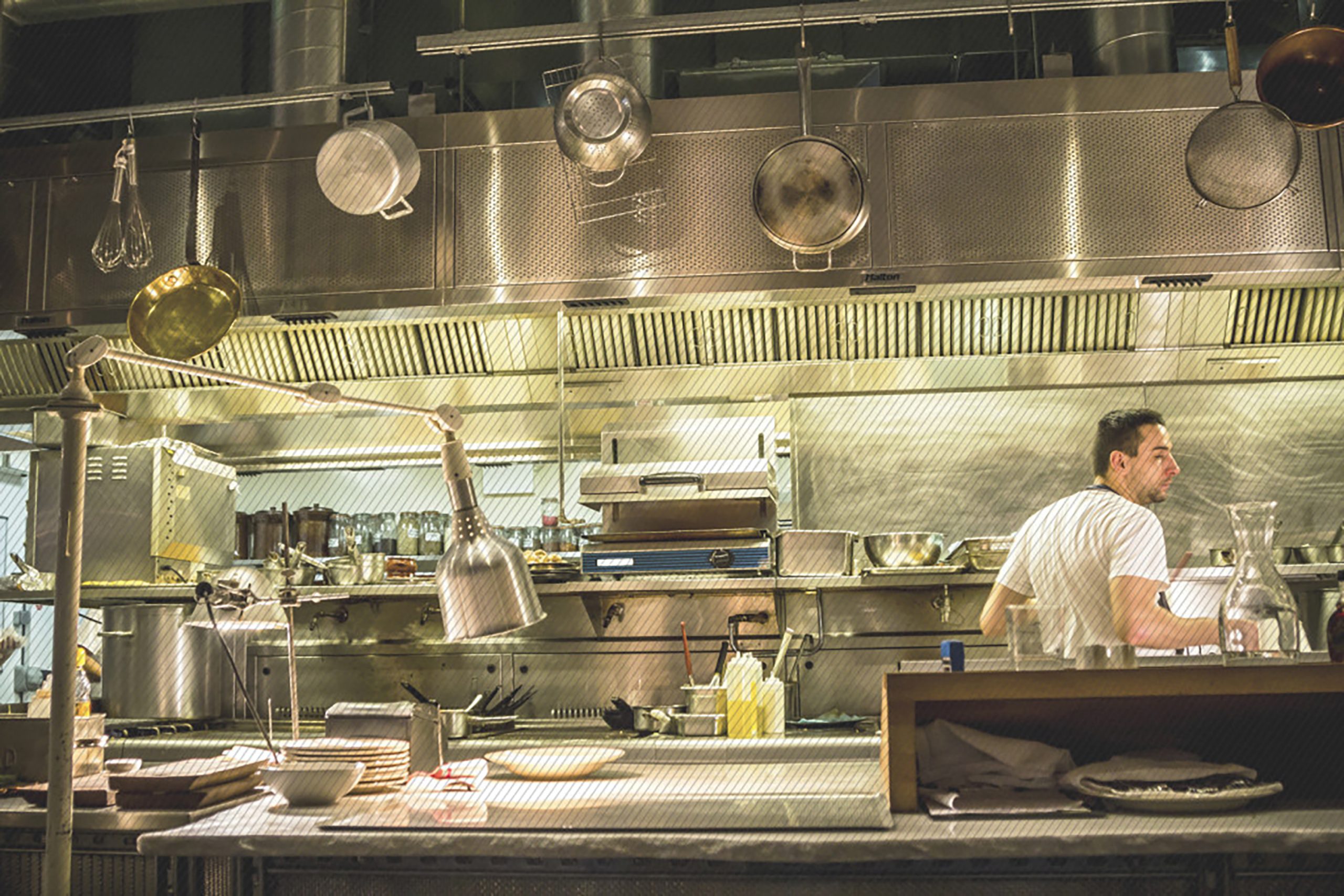 Featured image:  An employee preparing an order in a restaurant kitchen - Read full post: Creating the Right Line of Visibility for Your Customer Experience (CX)