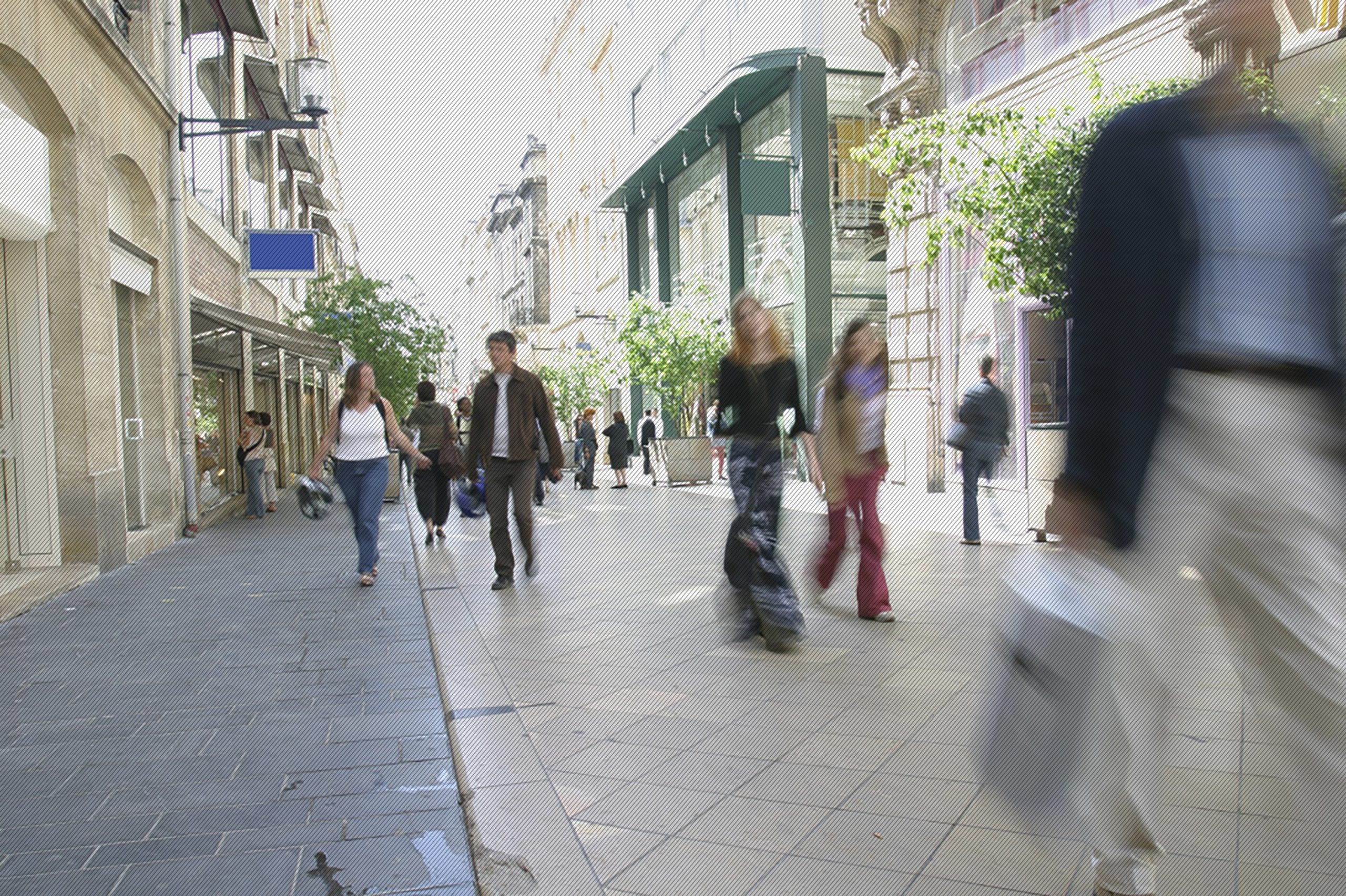 People walking in an outdoor shopping center